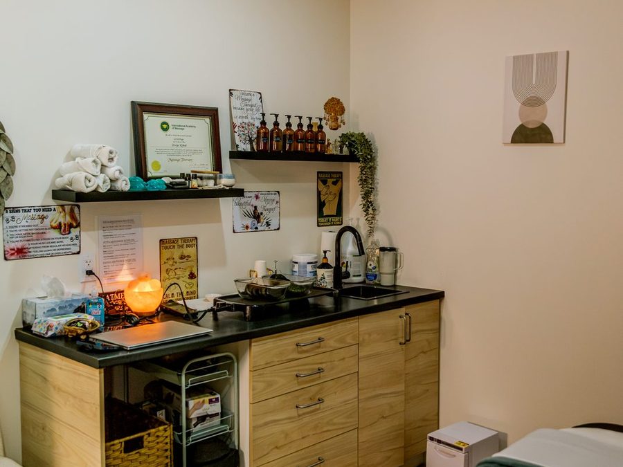 Massage treatment room at Healastic in Manotick, with hot stone warmer and treatment table
