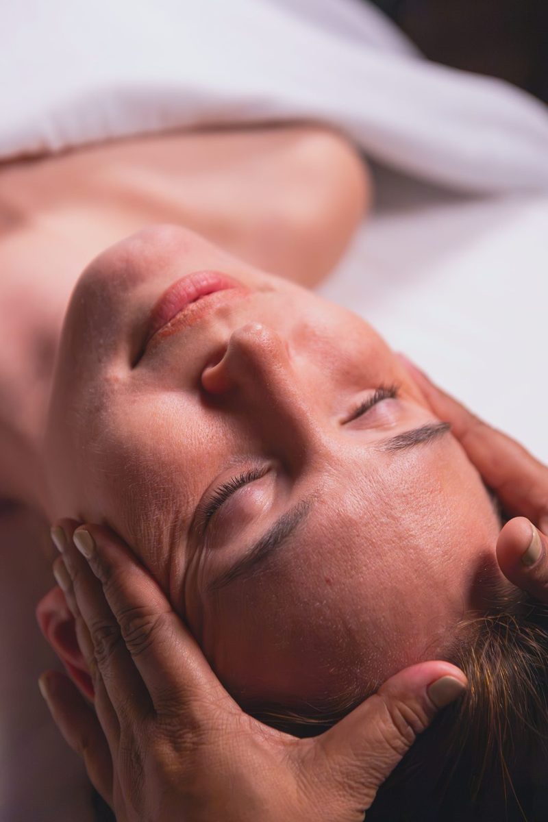 Scalp and temple massage during a head and scalp treatment at Healastic in Manotick