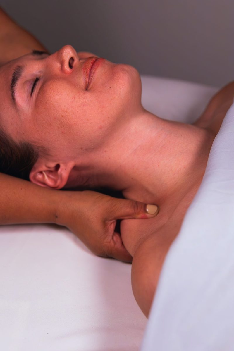 Light, rhythmic manual lymphatic drainage at the neck and collarbone in Manotick